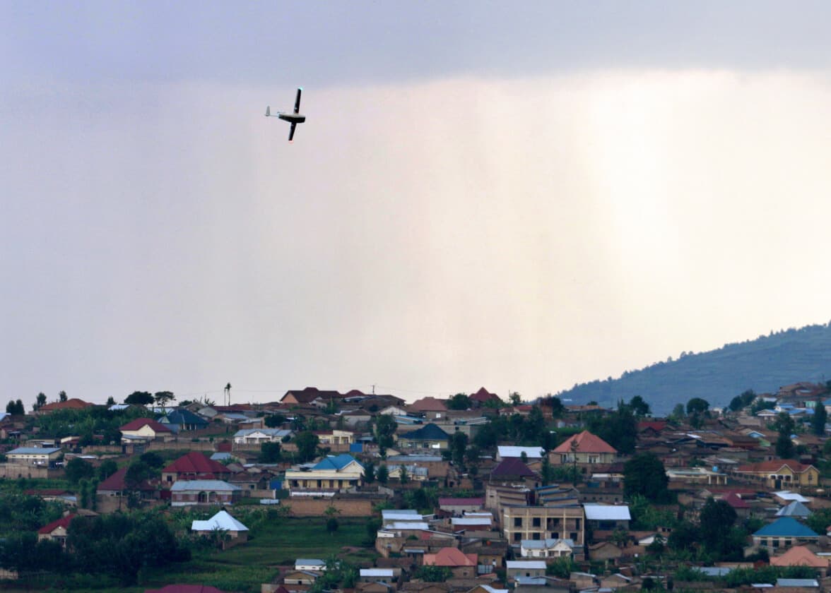 Zipline drone flying over a residential town.
