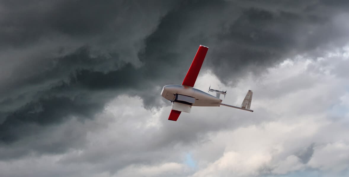 Zipline drone flying through stormy clouds.